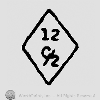 Number 12 and uppercase C over number 2 in a diamond