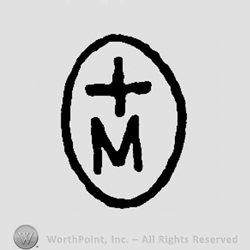 Cross and uppercase M inside an oval