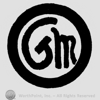 Letters G, M in circle.