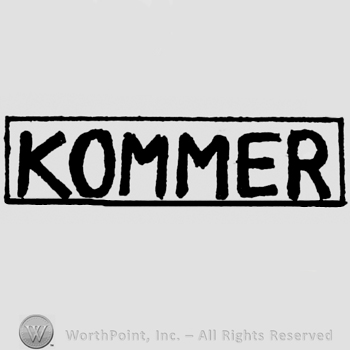 KOMMER written in rectangle.