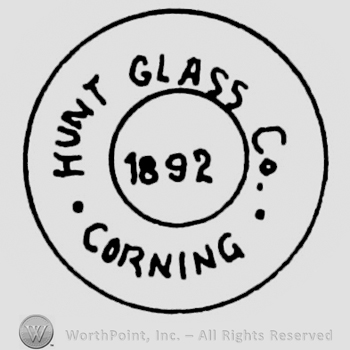 "Hunt Glass Co. Corning 1892" written with uppercase letters inside a circle