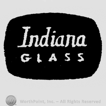 "Indiana Glass" written in white lettering inside a black oval design