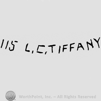 "115 L.C. Tiffany" written with uppercase letters