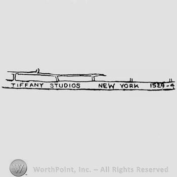 "Tiffany Studios New York 1529-" written with uppercase letters on a strip
