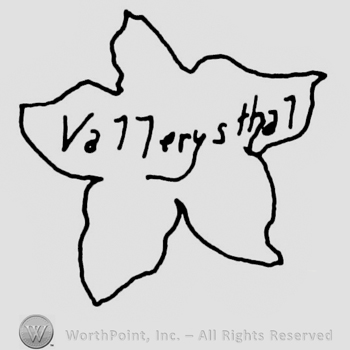 "Vallerysthal" written with uppercase letters and a complex design inside a flower