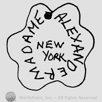 Madame Alexander New York written with uppercase letters inside a flower-like design