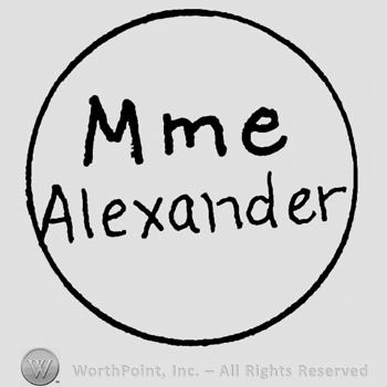 Mme Alexander written with lowercase letters inside a circle
