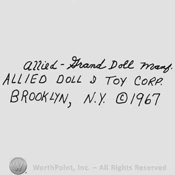 Allied-Grand Doll Manf.handwritten with lowercase letters, Allied Doll & Toy Corp. Brooklyn, N.Y. written with uppercase letters, the Copyright symbol and number 1967