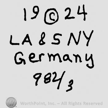 Year 1924 with the Copyright symbol in the middle, capital LA&SNY, Germany with lowercase letters and numbers 982 over 3 below