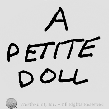 A Petite Doll written with uppercase letters