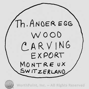 Th. Anderegg Wood Carving Export Montreux Switzerland written with uppercase letters inside a circle