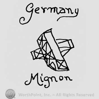 Germany Mignon handwritten with lowercase letters and a complex design similar to carved wood