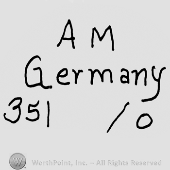 Uppercase AM over Germany written with lowercase letters and number 351 over 0
