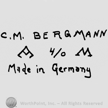 C.M. Bergmann written with uppercase letters over triangular-shaped design, number 4/0 and uppercase M, Made in Germany written below with lowercase letters