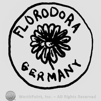 Florodora Germany written with uppercase letters around a flower inside a circle