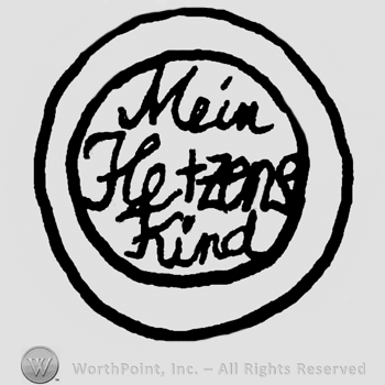 Double circle and Mein Hertzens Kind handwritten inside with lowercase letters