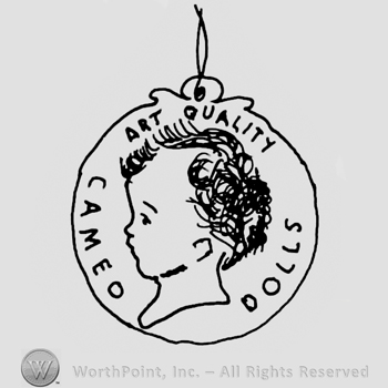 Baby boy's head in profile, Cameo Dolls Art Quality written around it with uppercase letters