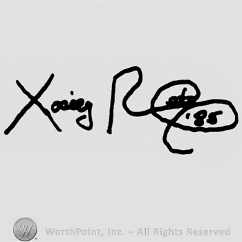 Signature-like writing made of two words/names starting with capital X, capital R and number 85