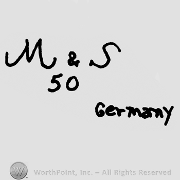 Uppercase handwritten M&S over number 50 and Germany written with lowercase letters