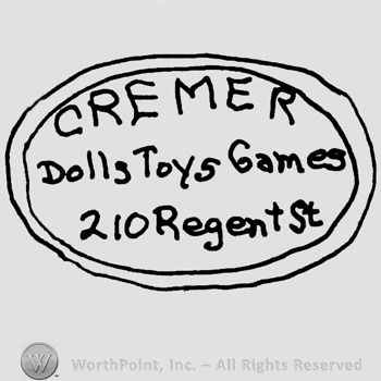Cremer written with uppercase letters, Dolls Toys Games 210 Regent St. Written with lowercase letters, all inside a double-lined oval