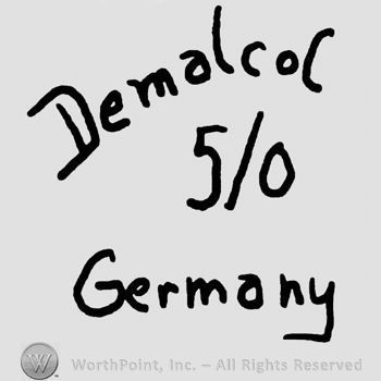 Demalcol Germany written with lowercase letters, 5 over 0