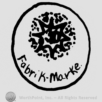 Star with dots around, Fabrik Marke written below wit lowercase letters, all inside a circle