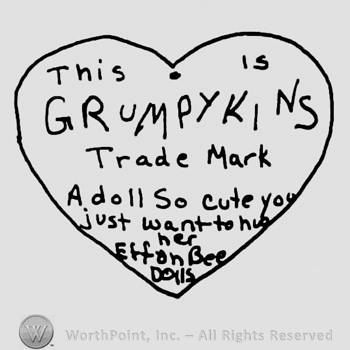 This is Grumpykins written with uppercase letters over Trade Mark A doll so Cute you jus wat to hug her, Effanbee Dolls written with lowercase letters, all inside a heart
