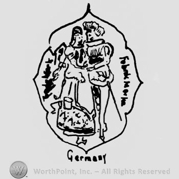 Two stylized dolls holding hands inside an oval design, Germany written below with lowercase letters