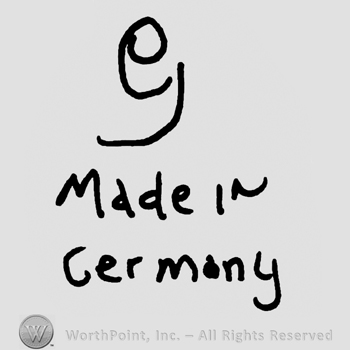 Uppercase handwritten G over Made in Germany written with lowercase letters