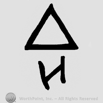 Triangle over uppercase mirrored N or capital H