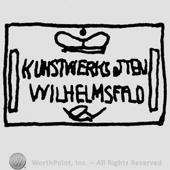 Crown over Kunstwerks Jten Wilhelms Ffld written with uppercase letters, all inside a rectangle