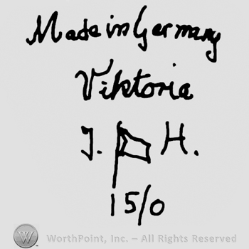 Made in Germany Viktorie handwritten with lowercase letters over uppercase J.H.with a banner between, number 15/0 written below