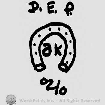 Horse shoe; A K inside ; DEP on top