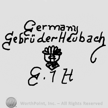 Germany Gebruder-Heubach written with lowercase letters over a complex design, uppercase handwritten E and H framing number 7
