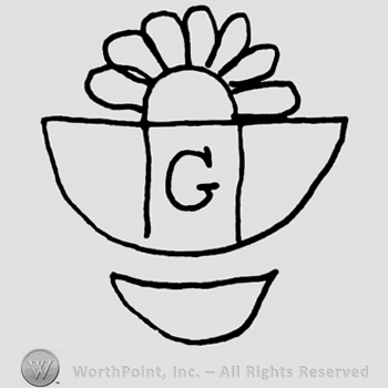 Half flower design inside a lower half of a circle, uppercase G written on it, half-circle below