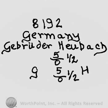 Number 8192 over Germany Gebruder Heubach written with lowercase letters, number 5 and 0 in fraction next to 1/2, number 5 and 0 in fraction next to 1/2 and uppercase GH written on the sides
