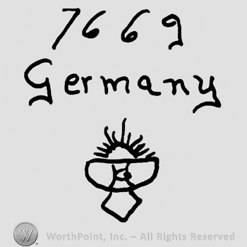 Number 7669 written over Germany written with loowercase letters, half sun in half circle with uppercase GH written on it