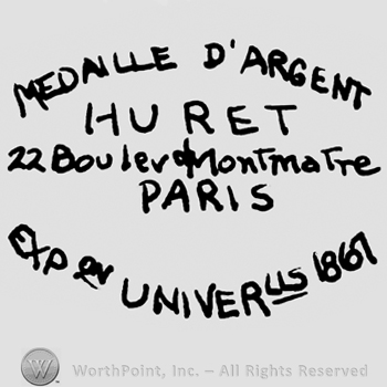 Medaille D'Argent Huret written with uppercase letters over 22 Boulevard Montmartre written with lowercase letters, Paris written with uppercase letters over Exp. Univerus 1861 also written with uppercase letters