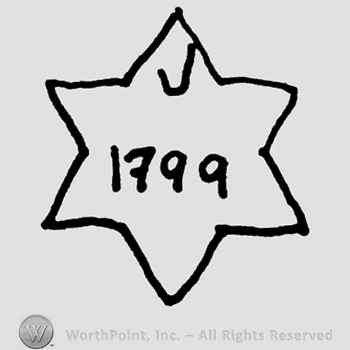 Six-cornered star, uppercase V and number 1799 written inside