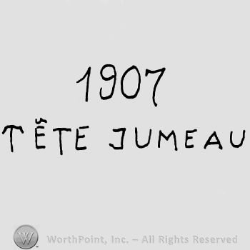 Number 1907 over Tete Jumeau written with uppercase letters