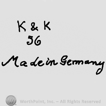 Uppercase K&K over number 36, Made in Germany handwritten with lowercase letters