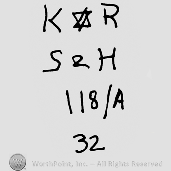 Uppercase KR with David's star in between over uppercase S&H, numbers 118 over uppercase A and number 32