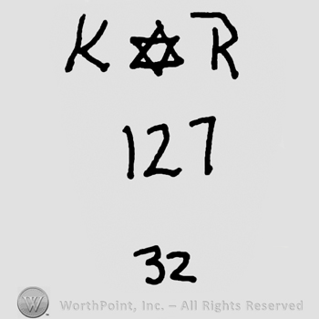 Uppercase KR with David's star in between over numbers 127 and 32