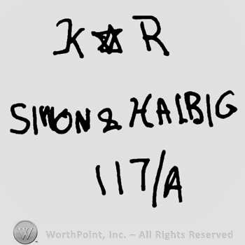 Uppercase KR with the star of David in between over Simon & Halbig written with uppercase letters, number 117over capital A writtten below