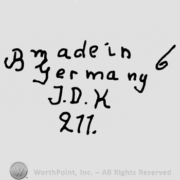 Made in Germany written with lowercase letters over uppercase J.D.K. And number 211 precedeed by capital B