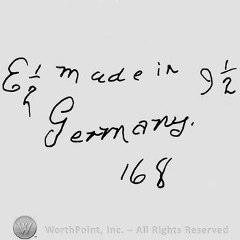 Made in Germany handwritten with lowercase letters, precedeed by capital handwritten E and 1/2 and followed by number 9 and 1/2, number 168 written below