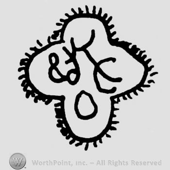 Uppercase KC&O written inside a stylized four-leaf clover