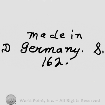Made in Germany written with lowercase letters precedeed by uppercase handwritten D and followed by number 8, number 162 written below