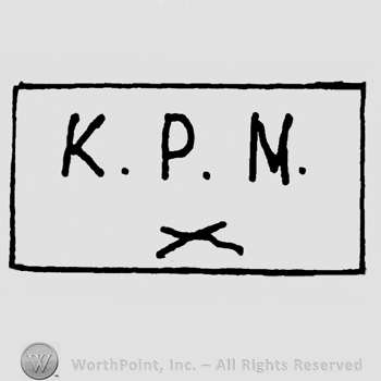 Uppercase K.P.N. Over two crossed lines, all inside a rectangle