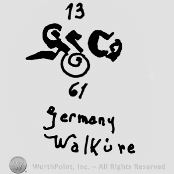 Number 13 over a complex design, number 61 written below, Germany Walkure written with lowercase letters